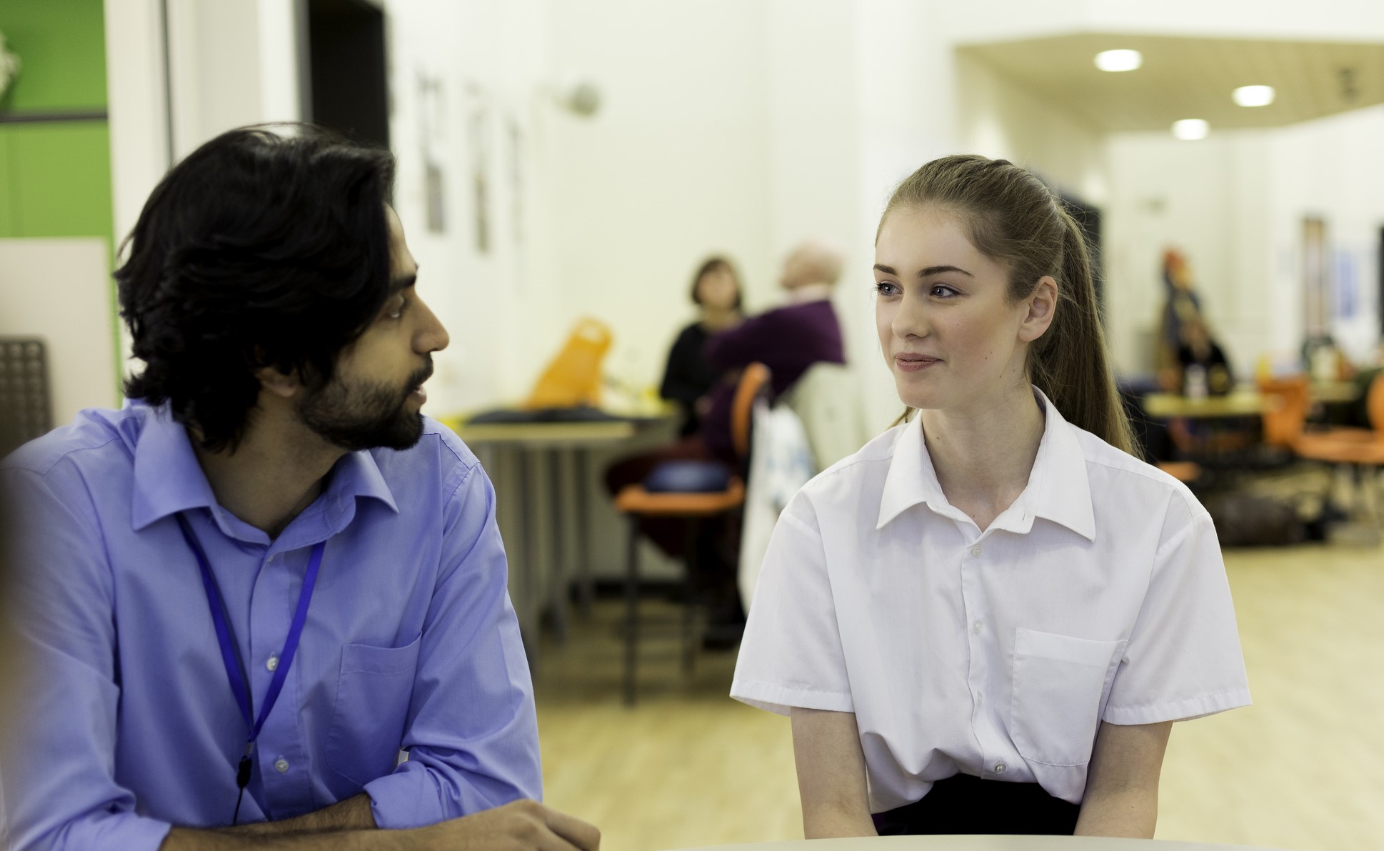 College Student speaking with tutor